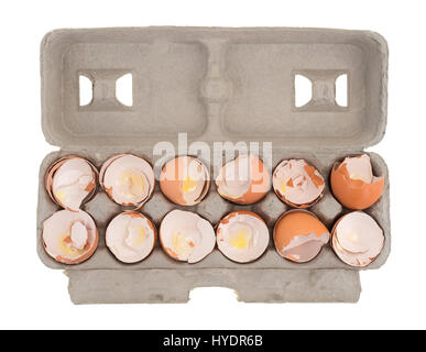 Top view of a dozen used egg shells in a cardboard container isolated on a white background. Stock Photo