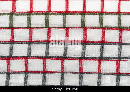 Close view of red and gray pattern dish cloths folded and in rows. Stock Photo