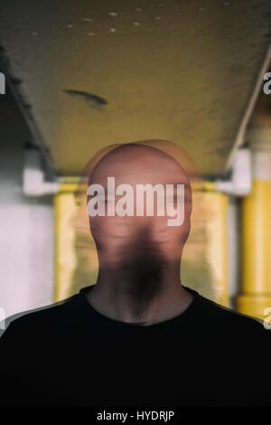 Abstract portrait of man shaking his head side to side Stock Photo