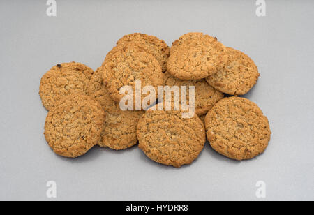 Group of oatmeal cookies in a small pile on a baking sheet. Stock Photo