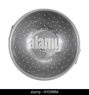 Top view of an old stainless steel colander still damp isolated on a white background. Stock Photo