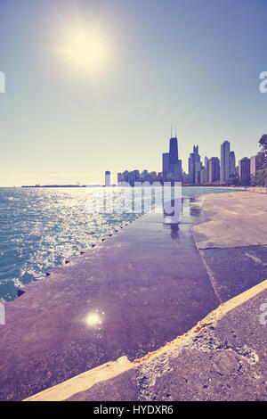 Color toned Chicago waterfront skyline against the sun, Illinois, USA. Stock Photo