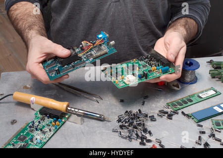 An employee at an electric service while at work. Stock Photo