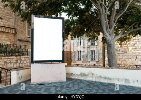 Empty vertical billboard in a place under a tree Stock Photo