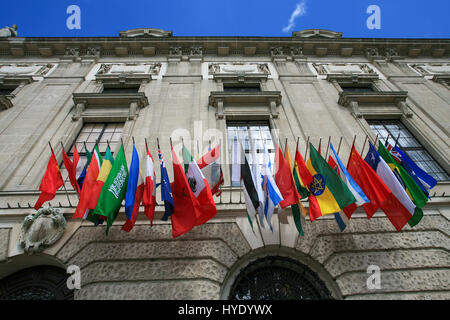 Many flags of the world on the facade of a historic building Stock Photo