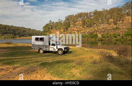 Home-made Land Rover campervan / mobile home at camping area beside ...