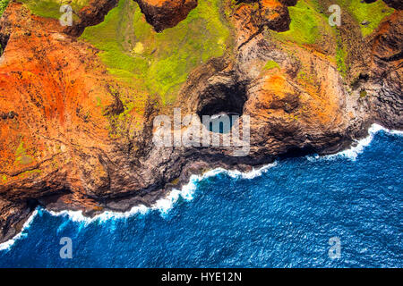 Aerial view of Na Pali coastline open ceiling cave from helicopter, Kauai, Hawaii, USA Stock Photo