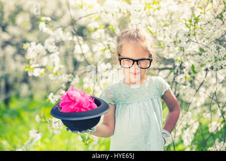 Funny girl in glasses with hat and gloves. Stock Photo