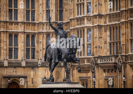 A statue of Richard Coeur de Lion (also known as Richard the Lionheart) in the old palace yard outside the Palace of Westminster. Stock Photo