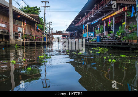 DAMNOEN SADUAK, THAILAND - CIRCA SEPTEMBER 2014: Canals around the Damnoen Saduak floating market in the central region of Thailand. Stock Photo