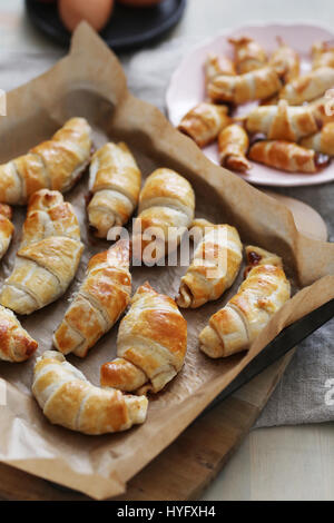 Food. Freshly baked croissants on the table Stock Photo