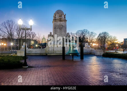 Liberty Bell replica in front of Union Station and Christopher Columbus statue at night - Washington, D.C., USA Stock Photo