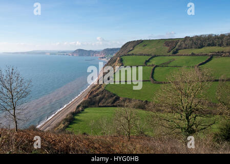 The view along Devons Jurassic Coast from Higher Dunscombe Hill looking westwards along the coast towards Salcombe Mouth, part of the East Devon AONB Stock Photo
