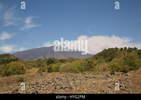 SICILY, ITALY: MOUNT Etna has been photographed exploding into life during its most recent eruption yesterday. Pictures show smoke billowing out from the top of the active volcano during the day. Other Images show Etna at night with glowing red molten lava trailing down the mountainside. The images were captured by local photographer Marco Restivo. Stock Photo