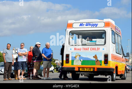 People queuing for an ice cream from a Mr Whippy ice cream van at Mayflower Park, Southampton, UK Stock Photo