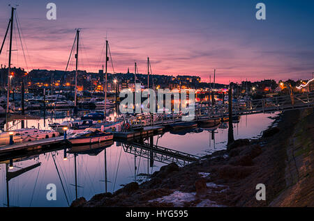 Sunset over Whitby Harbour, North Yorkshire, UK. Stock Photo