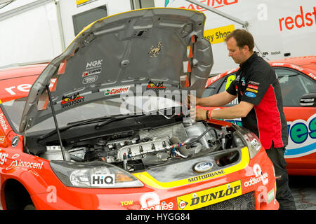 THRUXTON, UNITED KINGDOM - MAY 1: Mechanic working on the Airwaves Ford Focus belonging to driver Mat Jackson at the British Touring Car Championship  Stock Photo