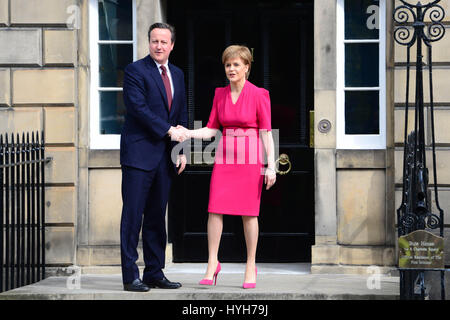 Scotland's First Minister Nicola Sturgeon shakes hands with Prime Minister David Cameron as he arrives for talks at Bute House in Edinburgh Stock Photo