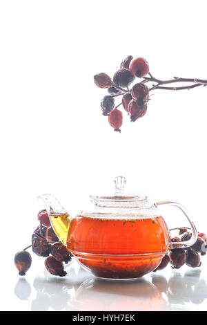 Dried red rose hips and tea Stock Photo