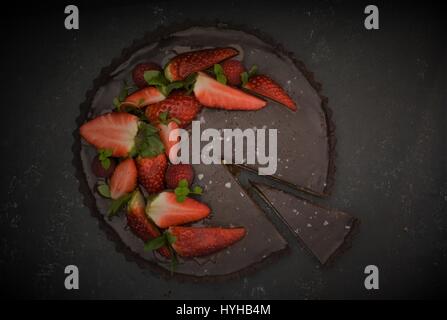 Chocolate Caramel Fudge Pie Tart with Strawberries Stock Photo