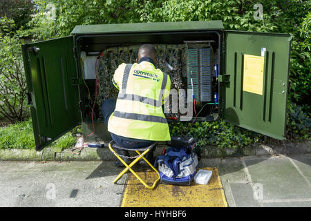 BT Openreach engineer, working on a roadside junction box, London, UK. Stock Photo