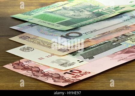 banknotes of the BRICS states on wooden background Stock Photo