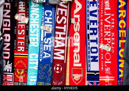 Football scarves for sale on a market stall in London Stock Photo