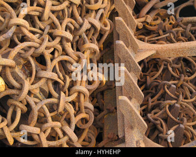 Rusted fishing tackle dredger chain. Full frame, abstract composition. Stock Photo