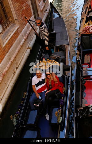 Tourists in a gondola, gondola, side canal, Venice, Veneto region, Italy Stock Photo