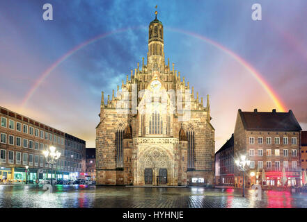 Nuremberg, cathedral Frauenkirche in Hauptmarkt wtih rainbow, Bavaria, Germany Stock Photo