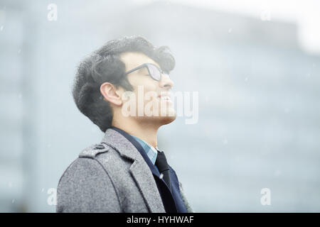 Middle-Eastern Man Enjoying Snow Stock Photo