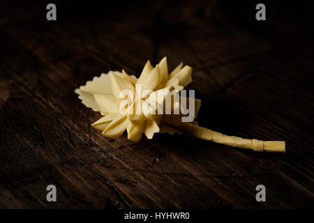 closeup of a small traditional spanish braided palm to be blessed on Palm Sunday on a rustic wooden surface Stock Photo