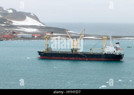 Cargo ship in Maxwell Bay, King Island, Antarctica Stock Photo