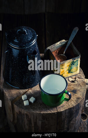 Freshly ground coffee brewed in an old jug Stock Photo