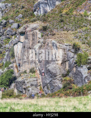 Rock climbers climbing the wall in Wanaka, New Zealand Stock Photo