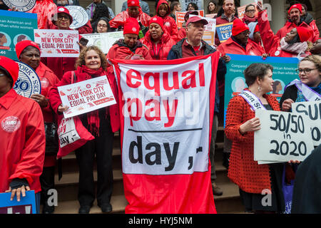 New York, USA. 04th Apr, 2017. Activists, community leaders and politicians gather on the steps of City Hall in New York on Tuesday, April 4, 2017 to rally against pay disparity on the 11th annual Equal Pay Day. Nationwide the gender wage gap is averaged at 20 percent. Legislation set to be voted on tomorrow by the NY City Council would prohibit employers from asking for the wage history of prospective employees, a practice that perpetuates wage inequality. ( © Richard B. Levine) Stock Photo