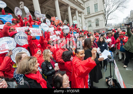 New York, USA. 4th April, 2017. New York, USA. 04th Apr, 2017. Activists, community leaders and politicians gather on the steps of City Hall in New York on Tuesday, April 4, 2017 to rally against pay disparity on the 11th annual Equal Pay Day. Nationwide the gender wage gap is averaged at 20 percent. Legislation set to be voted on tomorrow by the NY City Council would prohibit employers from asking for the wage history of prospective employees, a practice that perpetuates wage inequality. ( © Richard B. Levine) Credit: Richard Levine/Alamy Live News Stock Photo