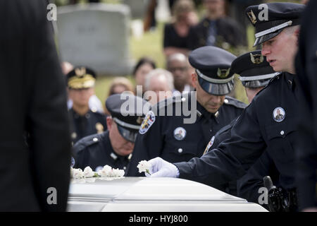 Louisville, Kentucky, Usa. 4th Apr, 2017. Officers Lay Flowers On The 