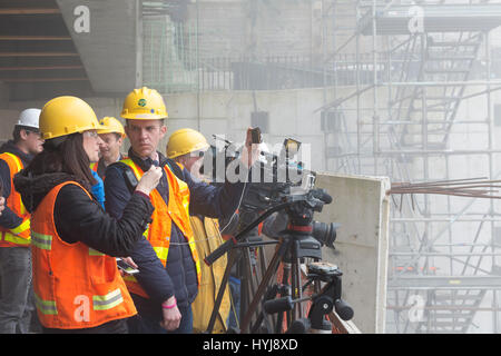 Seattle, Washington, USA. 4th Apr, 2017. Members of the media gathered to view the breakthrough of the cutterhead in the disassembly pit. The Alaskan Way Viaduct Replacement Program's tunnel-boring machine, nicknamed Bertha, broke through in South Lake Union on April 4, 2017. Originally launched in 2013, the tunnel-boring machine was halted after overheating due to damage to the cutterhead’s drive gears, bearings and seals resulting in a two-year delay. Digging resumed in 2016 after the machine was repaired. Credit: Paul Gordon/Alamy Live News Stock Photo