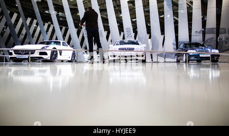 Essen, Germany. 5th Apr, 2017. A visitor looks at cars from Mercedes Benz at the Techno Classica for 'Oldtimers' and 'Youngtimers' in Essen, Germany, 5 April 2017. The world trade fair will take place from the 5th to the 9th April. Photo: Marcel Kusch/dpa/Alamy Live News Stock Photo