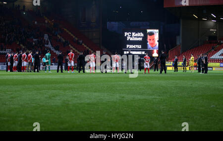 Players and members of the Police stand for a minutes silence in memory of PC Keith Palmer, who was one of the victims of the Westminster terror attack, during the Sky Bet League One match at The Valley, London. Stock Photo