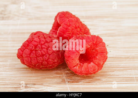 Raspberries on a wooden board. Stock Photo