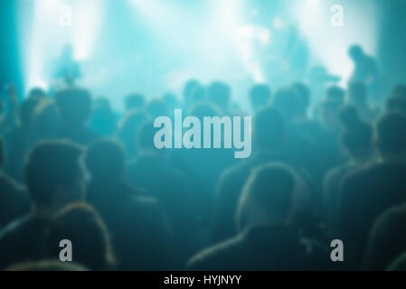 Blur defocused concert crowd as abstract background, people at popular rock music live performance Stock Photo