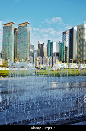 DOHA, QATAR - FEBRUARY 17, 2016: The high-rise district of Doha, seen from the recently completed Hotel Park, with fountains in the foreground Stock Photo