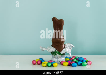 chocolate bunny for easter, against a blue background Stock Photo