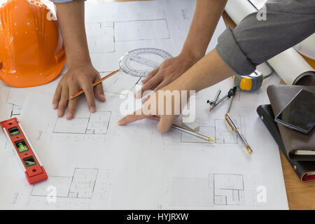 Architect working on blueprint. Architects workplace - architectural project, blueprints, ruler, calculator, laptop and divider compass. Construction  Stock Photo