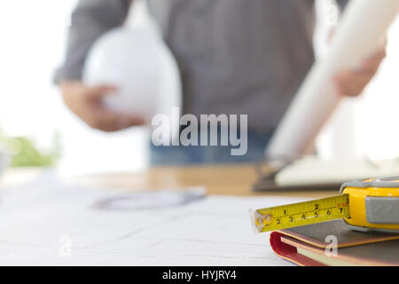 architect drawing on blueprint architectural concept, soft focus Stock Photo