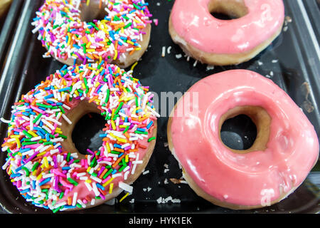 Orlando Winter Park Florida,Krispy Kreme Doughnuts,donut company,coffeehouse,sprinkles,pink glaze,donuts,icing,display sale FL170222145 Stock Photo