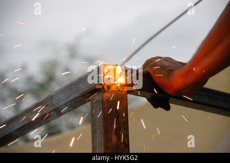 welding steel with spread spark and lighting around Stock Photo