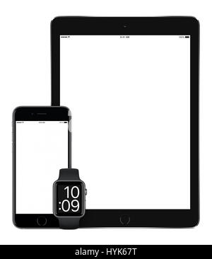 Responsive mockup consisting of vertical black tablet pc, mobile smartphone and smart watch. All gadgets in focus. Isolated on white background. Techn Stock Photo
